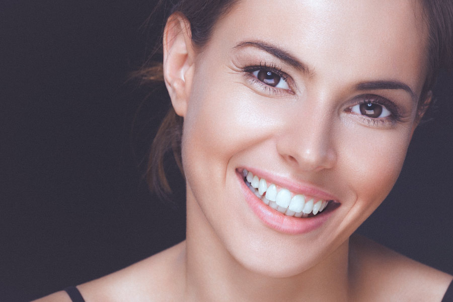 Pretty smiling brunette woman with beautiful teeth
