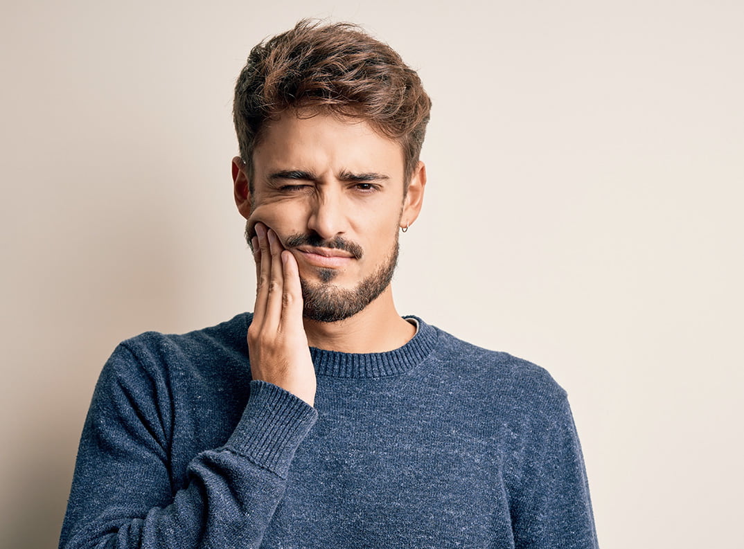 man with tooth pain