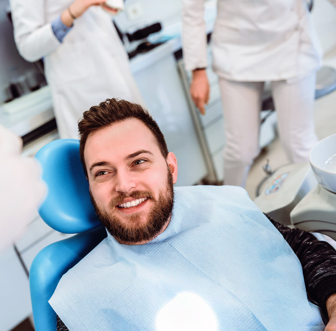 man smiling in dentist chair