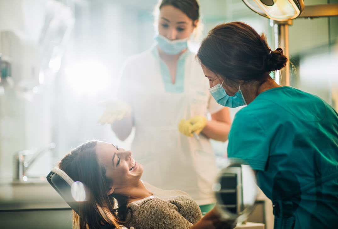 woman smiling in dentist chair