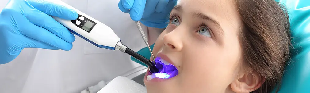 dentist examining a patient's mouth
