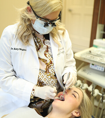 Dr. Wagner examining a patient's mouth