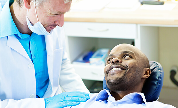 dentist talking with a patient