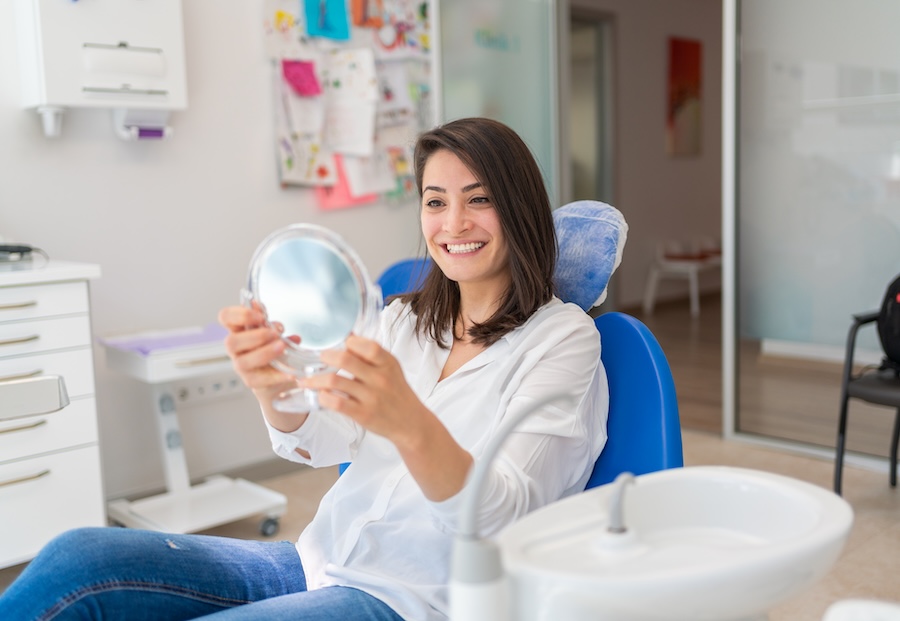woman smiling after juvederm at the dentist